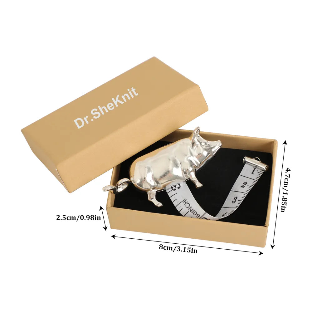Dimensions of silver pig tape measure and Dr.SheKnit kraft gift box