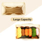 Large-capacity knitting storage bag interior with divided compartments holding multiple yarn skeins