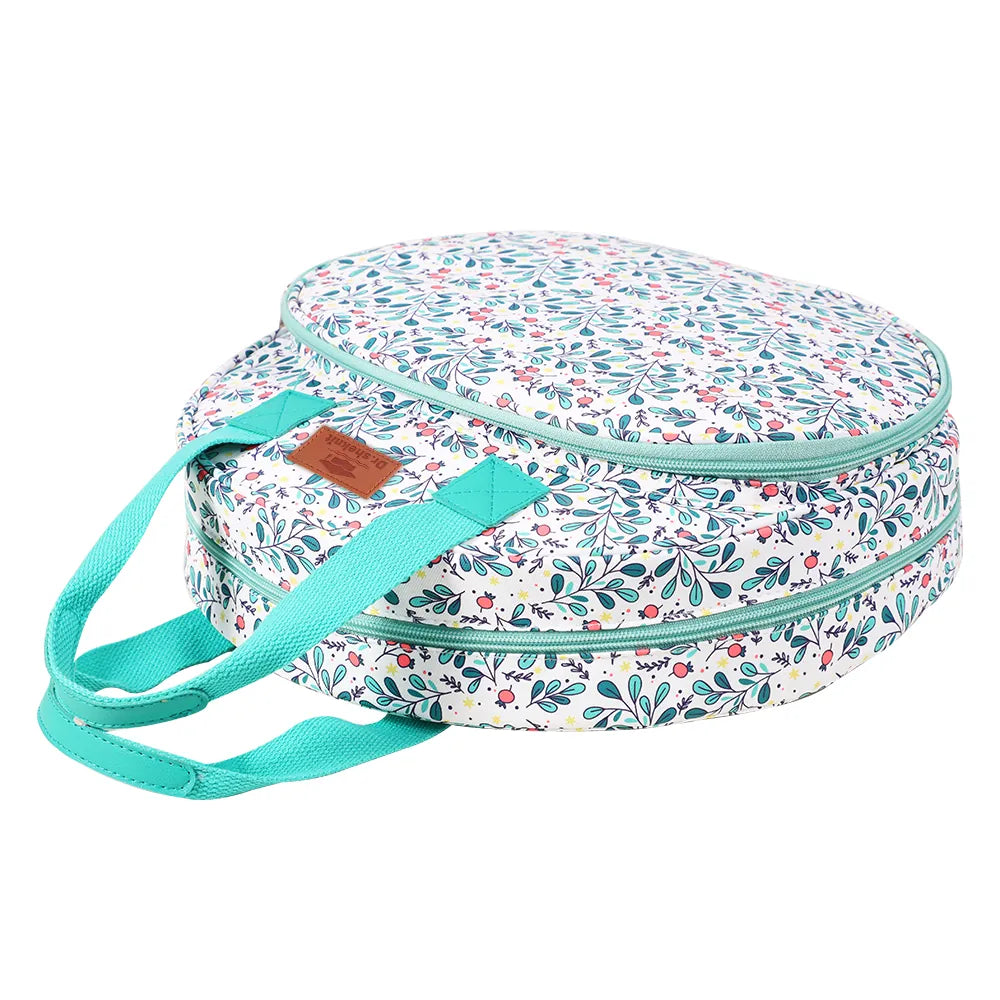 Side view of round floral embroidery hoop storage bag with dual zipper compartments