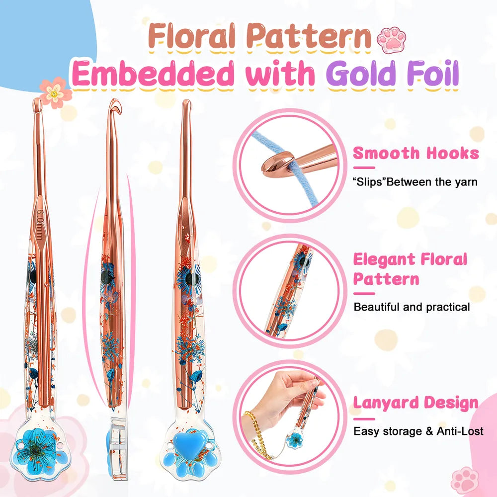 Smooth rose-gold-tone crochet hook with embedded flowers, gold foil and lanyard opening